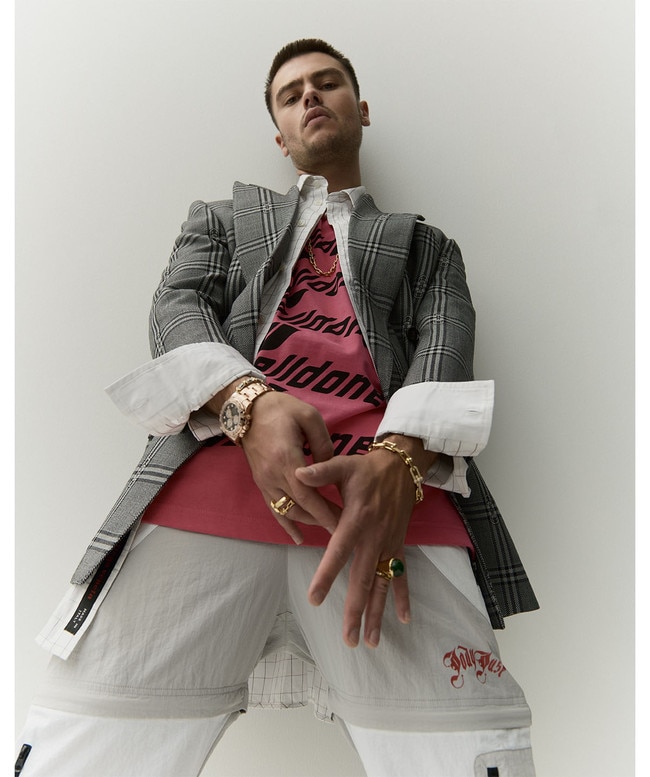 Jacket by Gucci; shirt by Bottega Veneta; T-shirt by We11done at Marais; pants by Jody Just; B57 mid-top sneakers by Dior Men; necklace, bracelets, rings, all by Tiffany & Co.; Cosmograph Daytona 40mm watch by Rolex. Picture: Jesse Lizotte