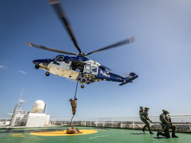 Choppers drop SOG members on the deck of the ship for the intense training operation. Picture: Jake Nowakowski