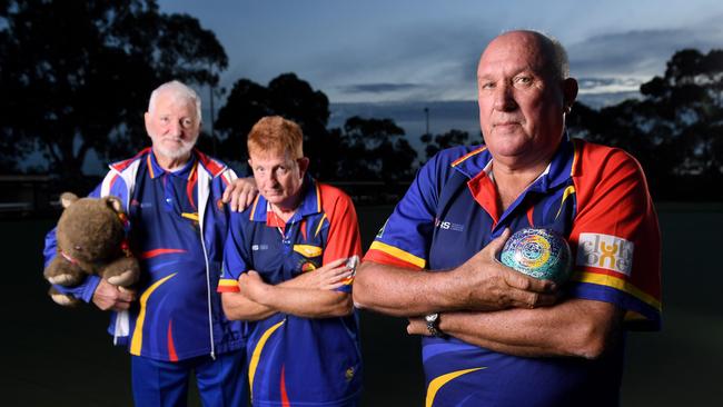 Barry Charity (right), with SA multi-disability lawn bowls team members Jim Fawcett and Mike Emberton, have been left in limbo due to funding cuts. Picture: Mark Brake