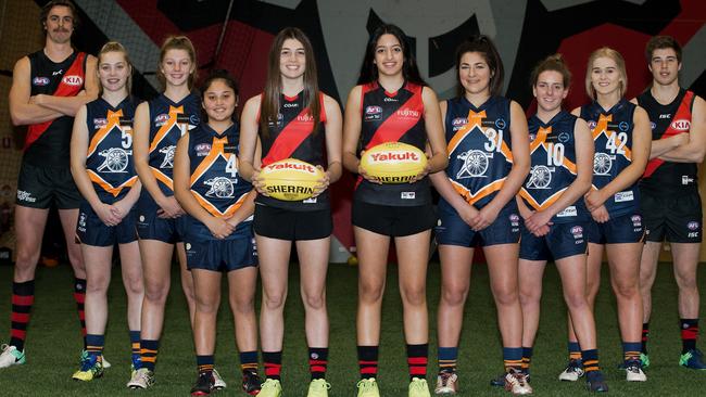 Essendon Football Club players Joe Daniher (far left) and Zach Merrett (far right) with prospective Essendon AFLW players. Shenay Thomas, Georgia Marsland, Chey Macumber, Georgia Patrikios, Stephanie Elias, Jacinta Taylor, Molly Hemburrow and Kellie Sutton. Picture: Ben Johnstone