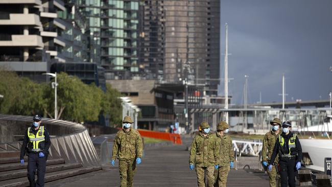 ADF and police on the streets in Docklands. Picture: NCA NewsWire / Sarah Matray