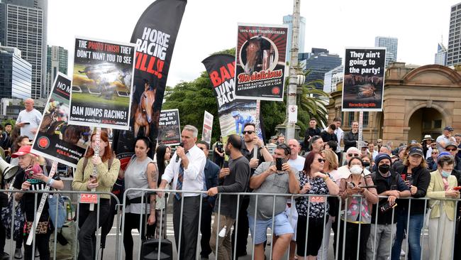 Members of the anti-horse racing group Coalition for the Protection of Racehorses protest as the Melbourne Cup parade passes over Princes Bridge in 2022. Picture: NCA NewsWire/Andrew Henshaw