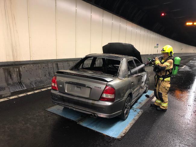 Tunnel fire demonstration in Sydney Harbour Tunnel, as part of research into electric car fires. The exercise involved a petrol car, but experts are warning about the need to research electric battery car fires. Picture: Supplied.