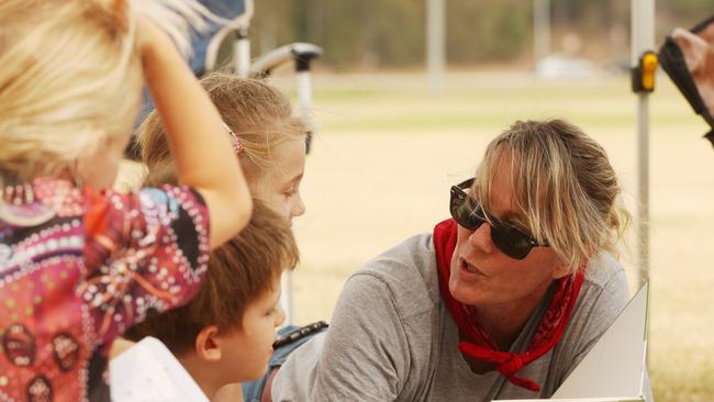 Eurobodalla Mayor Liz Innes speaks to local children at the evacuation centre during the bushfires. Picture: John Grainger