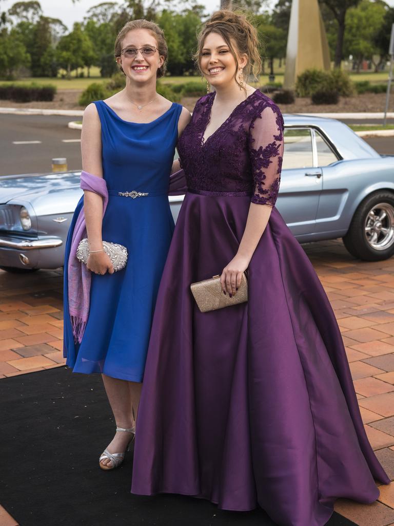 Jessica Moorman (left) and Alyssa Fraser arrive at Wilsonton State High School formal at USQ, Wednesday, November 18, 2020. Picture: Kevin Farmer