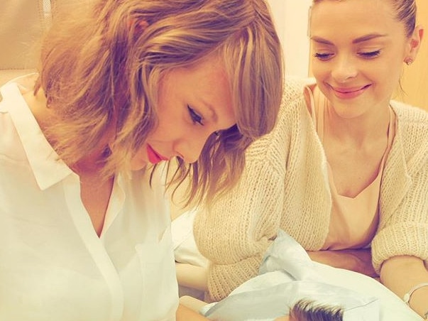 Taylor Swift pictured with King upon meeting her godson, a then newborn Leo.