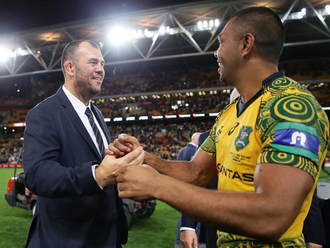 Michael Cheika and Kurtley Beale celebrate the win.