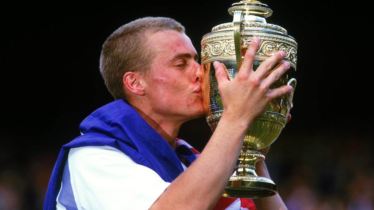 Lleyton Hewitt and the Wimbledon trophy he won in 2002. Picture: Mike Hewitt/Getty Images