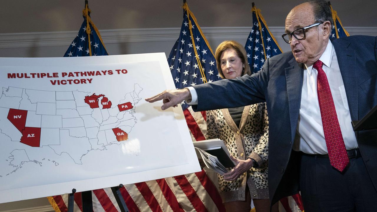 Rudy Giuliani points to Pennsylvania on a map as he speaks to the press about various lawsuits related to the 2020 election on November 19. Picture: Drew Angerer / Getty Images / AFP