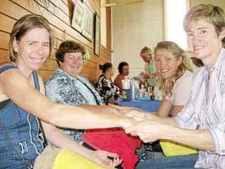 Amanda Summers, Christine Henry, Karen Thompson and Michelle Seabrook enjoy a hand massage at the Coalstoun Lakes pamper day. Picture: Contributed