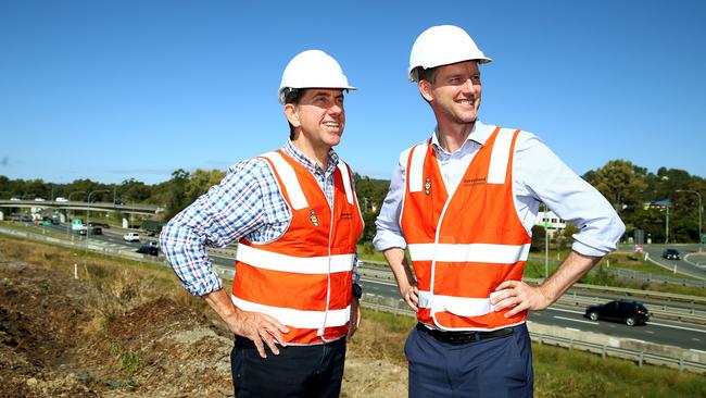 State Ministers Cameron Dick and Mark Bailey look over work on the M1. Picture: Adam Head