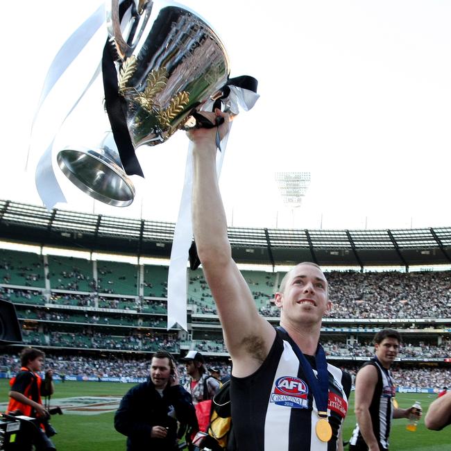 Nick Maxwell holds up the 2010 premiership cup.