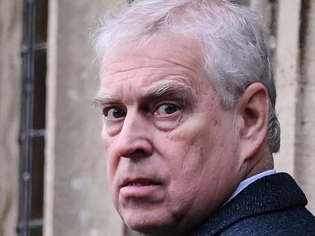 Britain's Prince Andrew, Duke of York reacts as he arrives for the Royal Family's traditional Christmas Day service at St Mary Magdalene Church in Sandringham, Norfolk, eastern England, on December 25, 2022. (Photo by Daniel LEAL / AFP)