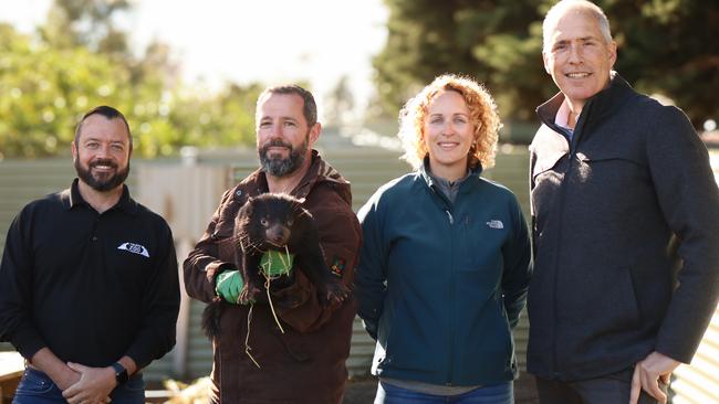 Toledo Zoo keeper Michael Frushoui, Tasmanian devil Ambassador Program co-ordinator David Sharp with Tequila the Tasmanian devil, Toledo Zoo small mammal area manager Koral Stoddard and Parks and Environment Minister Nick Duigan. Tequila is one of eight Tasmanian devils bound for the US as part of the Tasmanian devil Ambassador Program. Picture: Stephanie Dalton