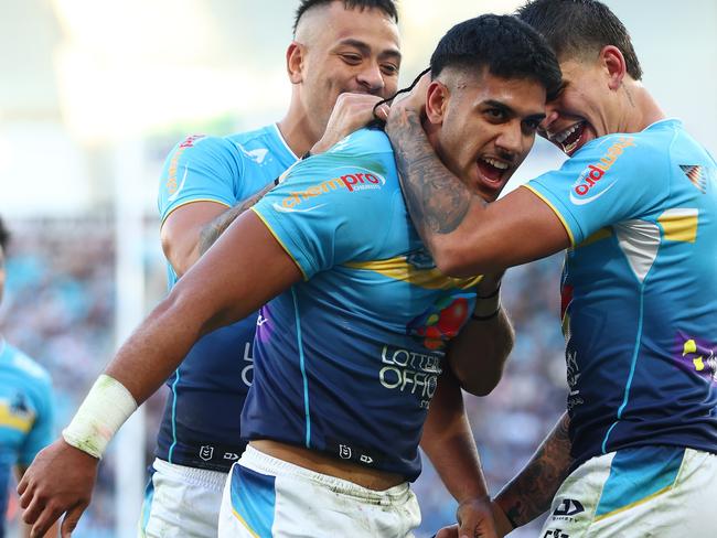 GOLD COAST, AUSTRALIA - JUNE 22: Alofiana Khan-Pereira of the Titans celebrates a try during the round 16 NRL match between Gold Coast Titans and New Zealand Warriors at Cbus Super Stadium, on June 22, 2024, in Gold Coast, Australia. (Photo by Chris Hyde/Getty Images)