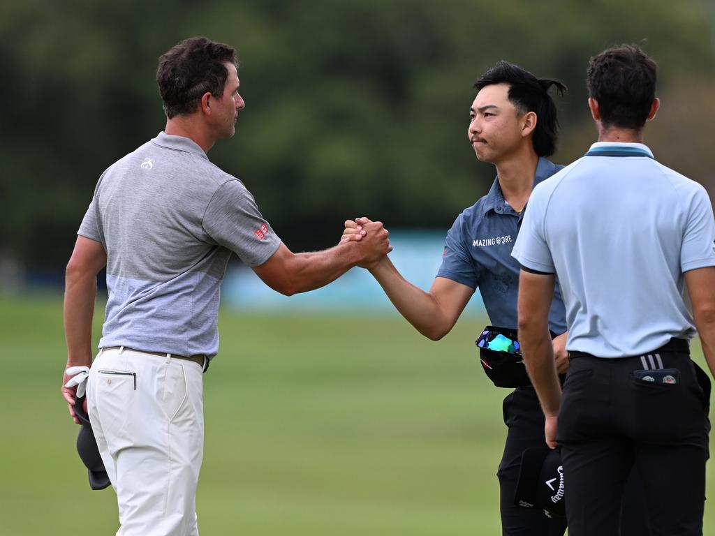 Adam Scott (left) and Min Woo Lee shake hands after the third round of the Australian PGA. Picture: Bradley Kanaris/Getty Images