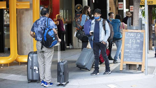 Guests leave Four Points by Sheraton on Brisbane CBD’s Mary St after a two-week mandatory quarantine. Picture: AAP