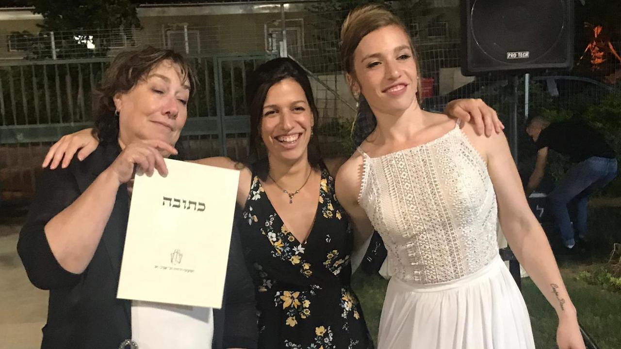 Galit Carbone, 66, with her daughter Maia (middle) and Nicole (right) on Nicole’s wedding day. Picture: Supplied