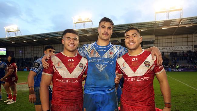 (L-R) Isaiya Katoa (Tonga), Joseph Suaalii (Samoa) and Will Penisini (Tonga) following the Rugby League World Cup Quarter Final match between Tonga and Samoa. Picture: Jan Kruger/Getty Images for RLWC