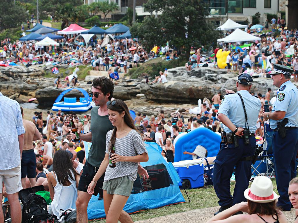 Large group of Australia day revelers party at Fairlight beach after the event was organized on Facebook. Picture: Adam Yip