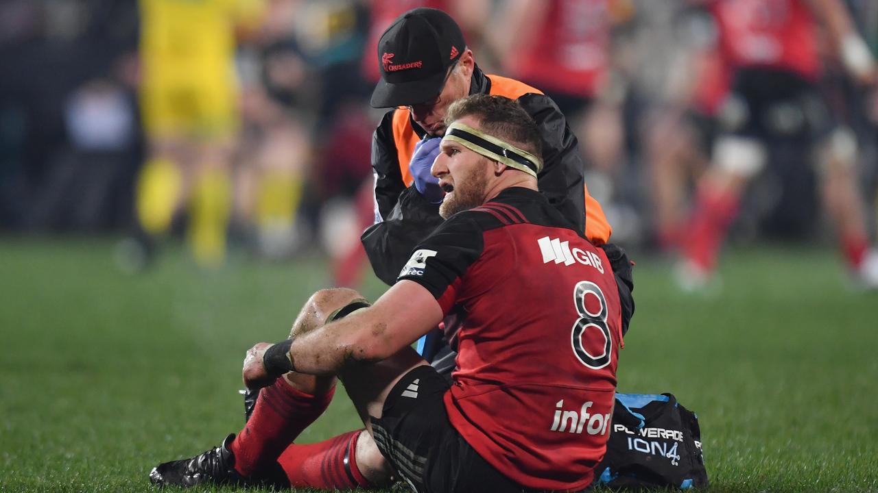 Kieran Read of the Crusaders receives medical help.