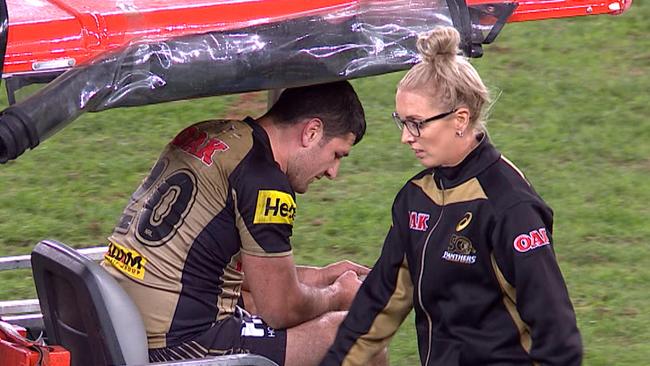 Sam McKendry leaves the field on a medi-cab after suffering a knee injury against the Wests Tigers.