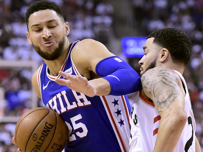 Philadelphia 76ers guard Ben Simmons (25) elbows Toronto Raptors guard Fred VanVleet, right, during the first half of Game 1 of a second-round NBA basketball playoff series in Toronto, Saturday, April 27, 2019. (Frank Gunn/The Canadian Press via AP)