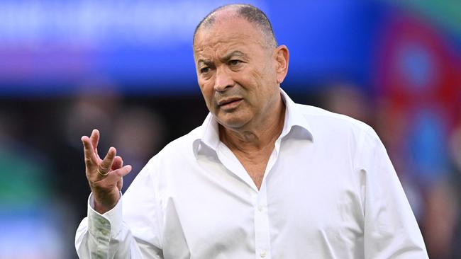 Australia's head coach Eddie Jones leads warm up prior to the   France 2023 Rugby World Cup Pool C match between Australia and Portugal at Stade Geoffroy-Guichard in Saint-Etienne, south-eastern France, on October 1, 2023. (Photo by SEBASTIEN BOZON / AFP)