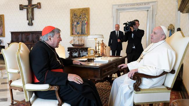 This handout photo taken on October 12 and released by the Vatican press office shows Pope Francis (R) talking with Cardinal George Pell during a private audience at the Vatican.