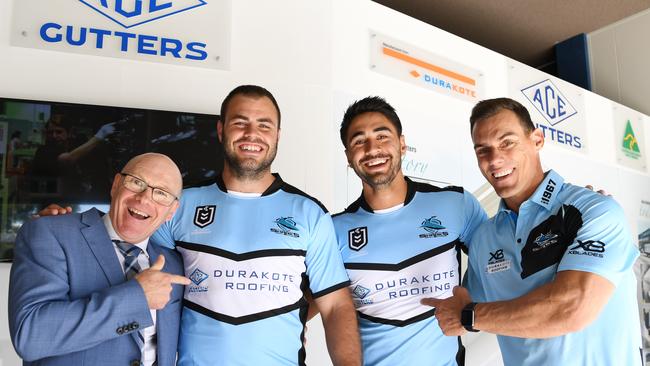 Barry Russell (far left) and John Morris (far right) have plenty to smile about now they have secured a jersey sponsor for the next two years and happily point it out on Wade Graham and Shaun Johnson’s jerseys. Picture: Tracey Nearmy