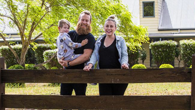 Luke Cameron and Sarah Raby with their son Fox at their ‘dream home’ they bought in March in the picturesque village of Glenlyon in Victoria. Picture: Aaron Francis