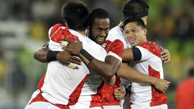 Japan's players celebrates winning the men's rugby sevens match against France at the Summer Olympics in Rio de Janeiro, Brazil, Wednesday, Aug. 10, 2016. (AP Photo/Themba Hadebe)
