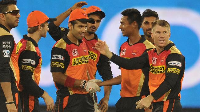 Sunrisers Hyderabad players including captain David Warner celebrate the wicket of Dinesh Karthik.