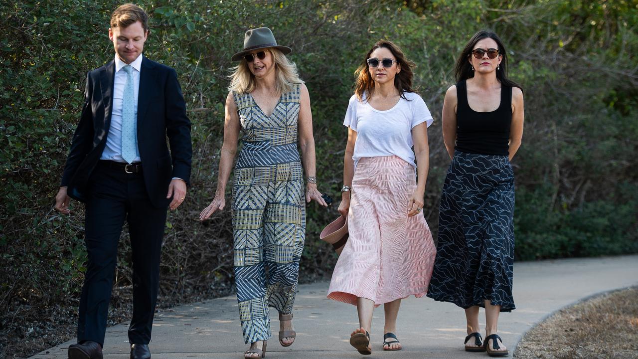 The family of Ngeygo Ragurrk's lawyer James Lowrey, left, with coroner Elisabeth Armitage, counsel assisting Peggy Dwyer and Maria Walz take part in a ceremony at Mindil Beach, where on December 23 2019 the 40-year-old woman was killed by her partner Garsek Nawirridj. Picture: Pema Tamang Pakhrin