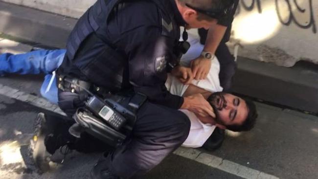 Saeed Noori is arrested in Flinders Street, Melbourne. Picture: AAP