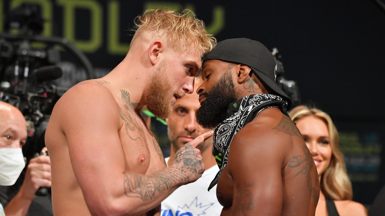 CLEVELAND, OHIO - AUGUST 28: Jake Paul and Tyron Woodley face off during the weigh in event at the State Theater prior to their August 29 fight on August 28, 2021 in Cleveland, Ohio. (Photo by Jason Miller/Getty Images)