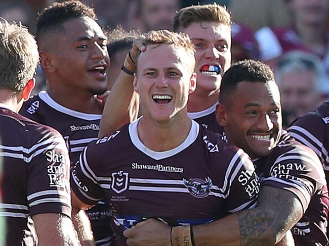 SYDNEY, AUSTRALIA - APRIL 06: Daly Cherry-Evans of the Manly Sea Eagles celebrates with team mates after kicking a goal in golden point to win the game during the round four NRL match between the Manly Sea Eagles and the South Sydney Rabbitohs at Lottoland on April 06, 2019 in Sydney, Australia. (Photo by Tony Feder/Getty Images)