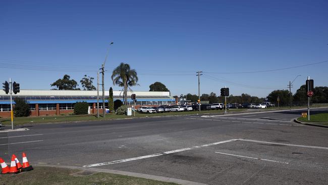 On Monday morning only broken glass and torn up police tape remained at the intersection of Milperra Rd and Murray Jones Drive. Picture: Richard Dobson