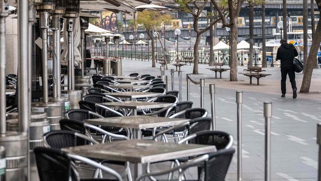 An empty cafe in Circular Quay, Sydney, as city’s lockdown is extended. Picture: NCA NewsWire / James Gourley