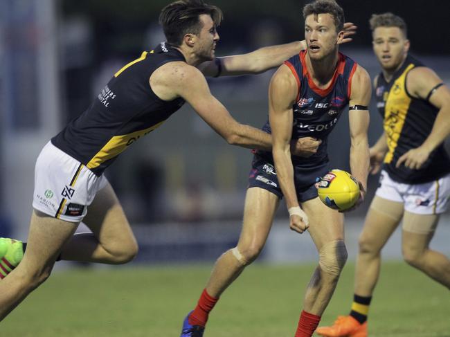 SANFL: Norwood v Glenelg at Norwood Oval - Glenelg's Liam McBean tackles Norwoods Zac Richards. 29 March 2019. Picture Dean Martin