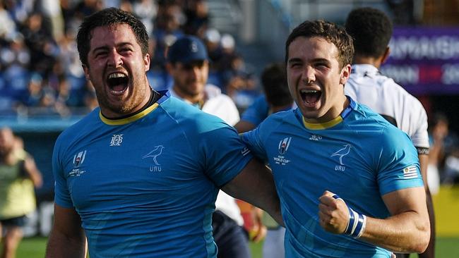 TOPSHOT - Uruguay's full back Felipe Etcheverry (R) and Uruguay's prop Facundo Gattas celebrate after winning the Japan 2019 Rugby World Cup Pool D match between Fiji and Uruguay at the Kamaishi Recovery Memorial Stadium in Kamaishi on September 25, 2019. (Photo by CHARLY TRIBALLEAU / AFP)