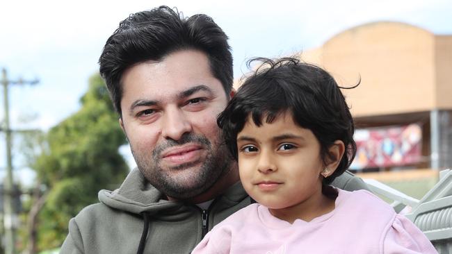 Jeet Gujral, with his niece Shanaya. Jeet, has family back in India who have all had COVID-19. He would like to go back and help his family but realises that he would be fined. Picture: Richard Dobson