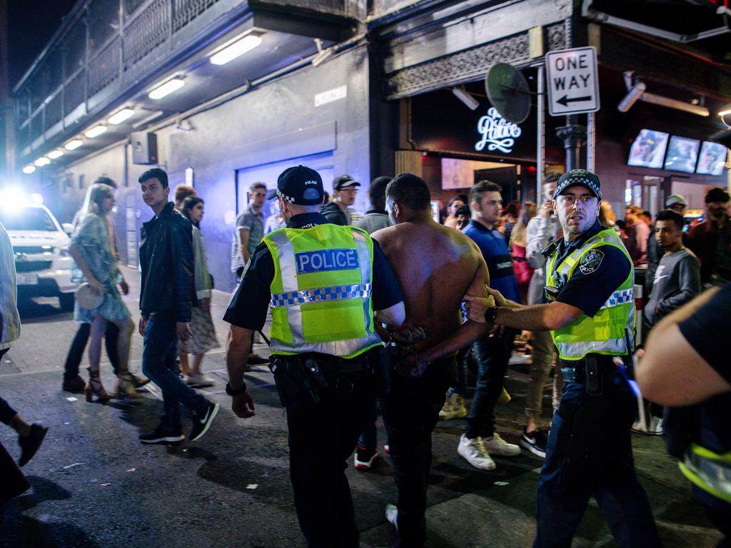 Police arrest a man in Hindley St just after midnight, New Year’s Day, 2020. Picture: AAP / Morgan Sette