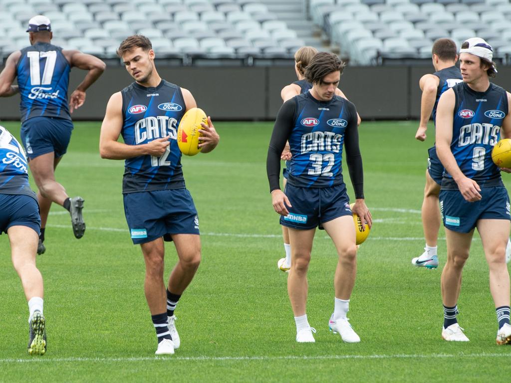 The Cats get moving on the training track. Picture: Brad Fleet