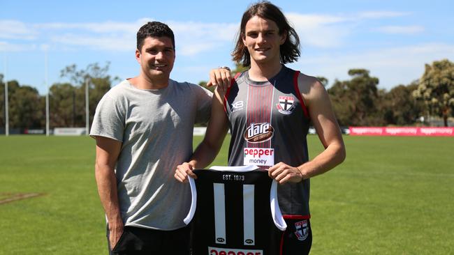 Leigh Montagna hands his No.11 to top draft pick Hunter Clark. Picture: Corey Scicluna