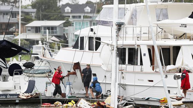 Pictured are staff at the Newport Anchorage in Newport clearing debris from a sunken yacht where it is thought a gas bottle exploded causing massive damage an injuring a female occupant who is in hospital with lacerations to her lower legs. Picture: Richard Dobson