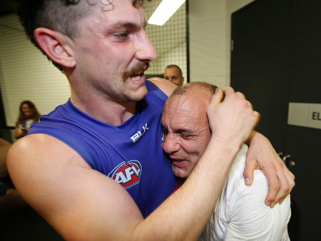 Tom Liberatore hugs his dad in the Bulldogs rooms. Picture: Michael Klein