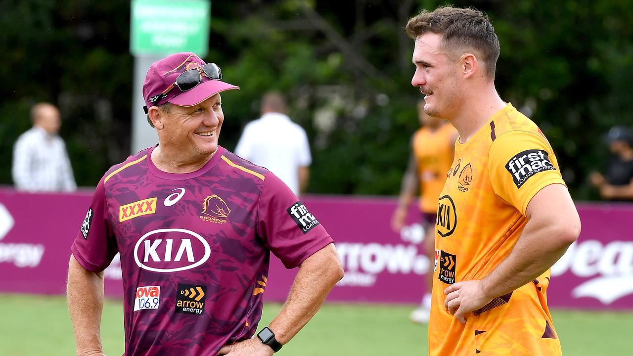 Kobe Hetherington with Brisbane Broncos head coach Kevin Walters at a training session at Red Hill. Photo: John Gass