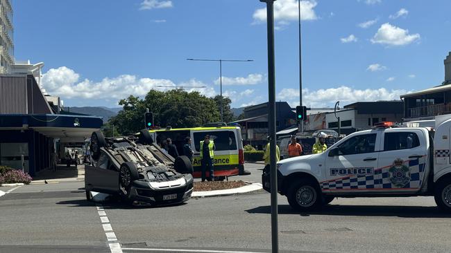 A silver SUV was left on its roof after a three car collision at the corner of Spence and Grafton Street in the Cairns CBD. Photo: Dylan Nicholson