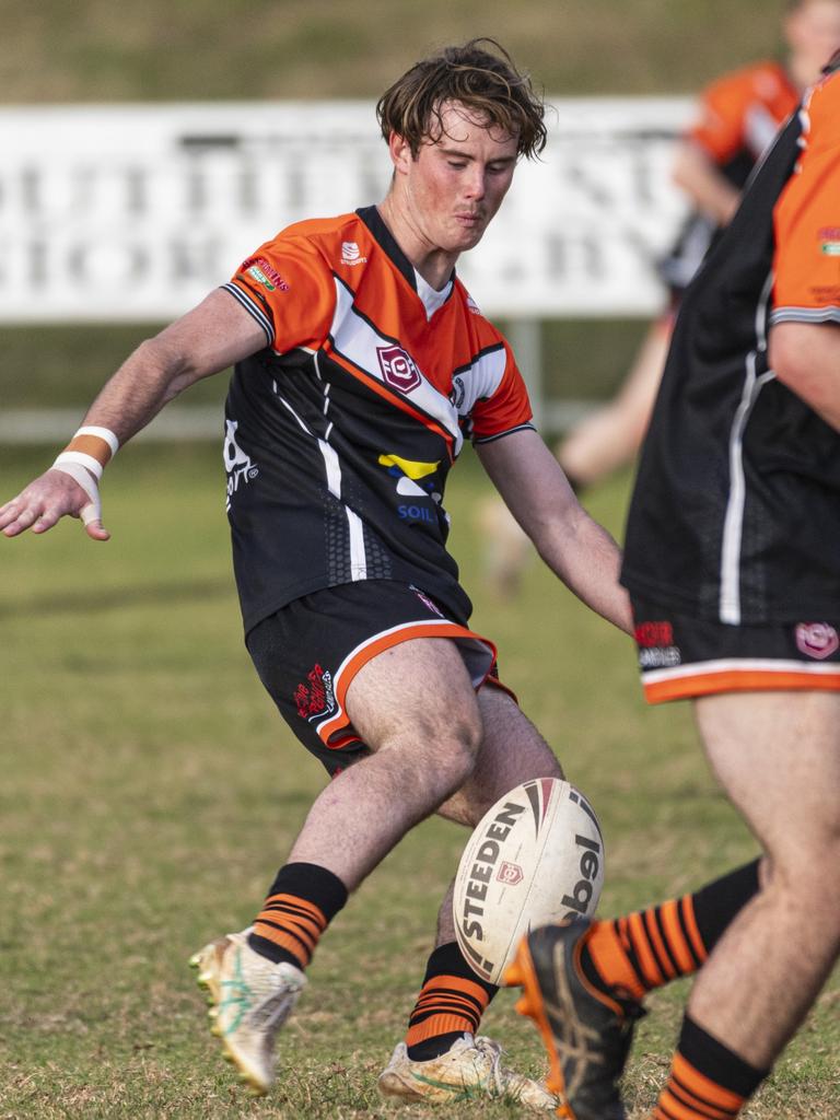 Tait Cameron kicks downfield for Southern Suburbs. Picture: Kevin Farmer